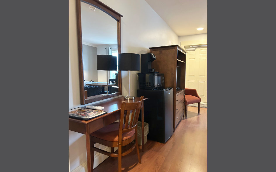 Barrier Free Room With TV, Chairs, Mirror, And Desk