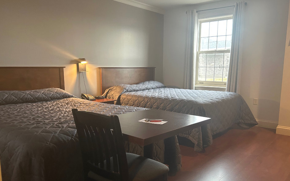 Standard Room With 2 Queen Beds And Table